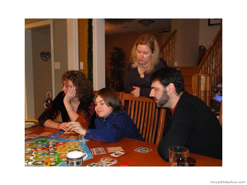 Melanie, Mason, Larissa and Andrew Playing Catan, Christmas