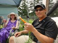 Sheila, Mike with Fresh Carrot at Christmas in July
