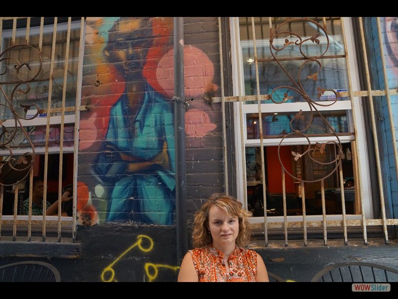 Rhonda with Artwork on the wall at Harlem