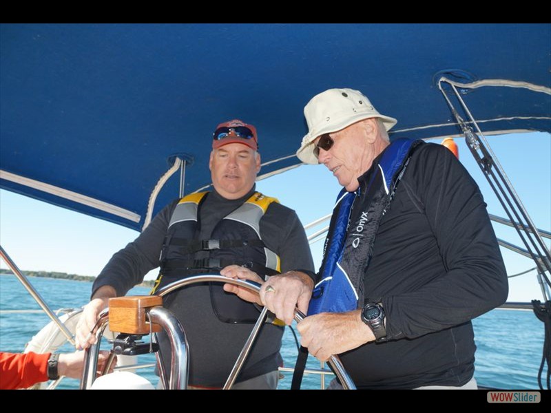 Sailing - Nick and Mr. Costar at the Wheel