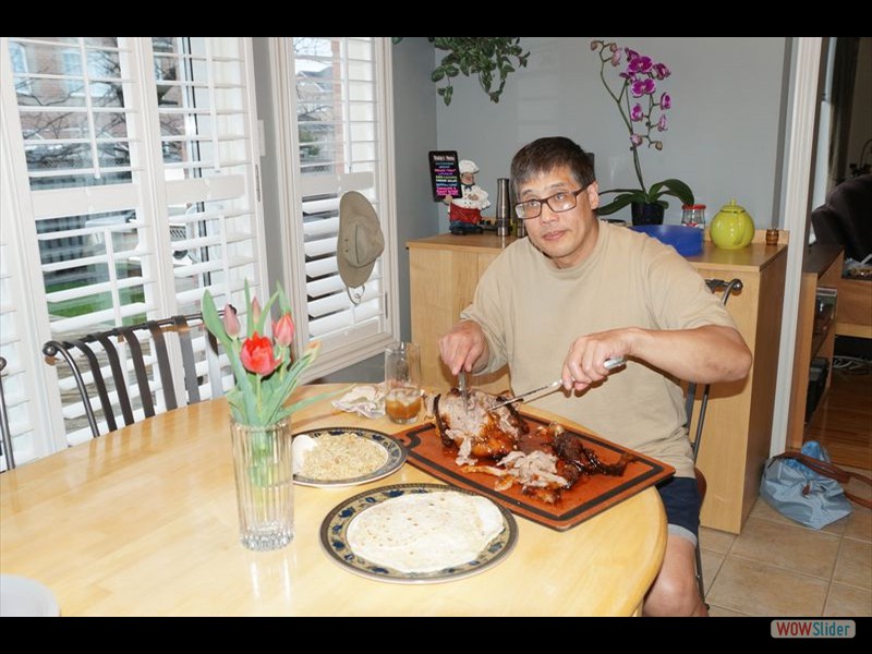 Mike Carving the Honey Duck with Rice and Homemade Pancakes