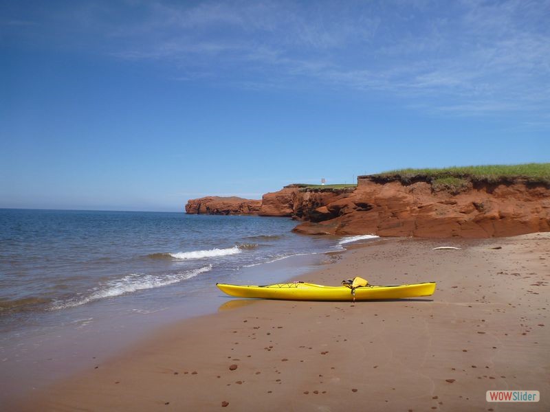 Kayaking Iles de la Madeleine 01 - Kayak with Lighthouse in the Distance